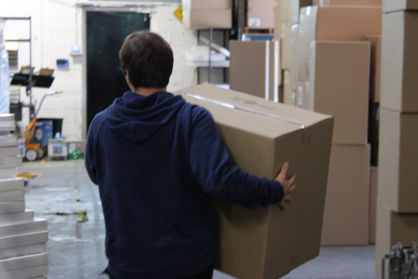 FilterHome Employee/Owner Carrying FilterHome Air Filters box